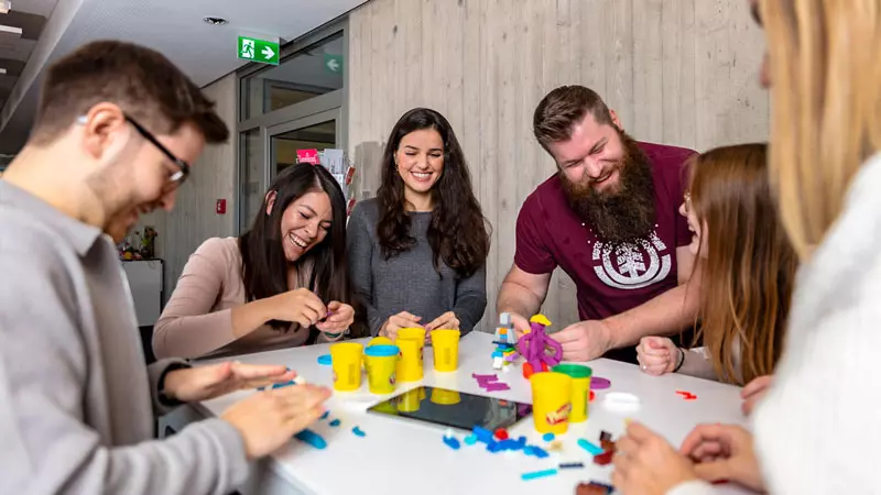 imc employees facing new challenges by playing with playdough