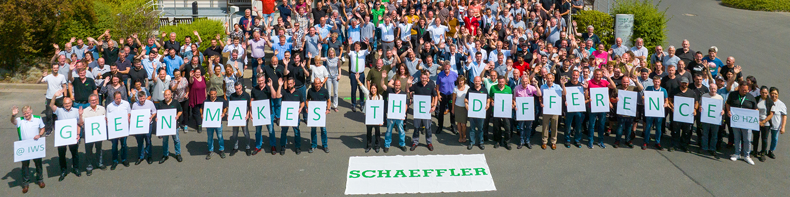 Schaeffler employees hold signs