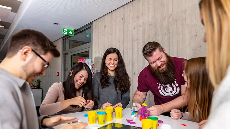 imc employees playing with playdough