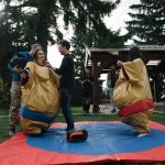 imc employees in sumo suits
