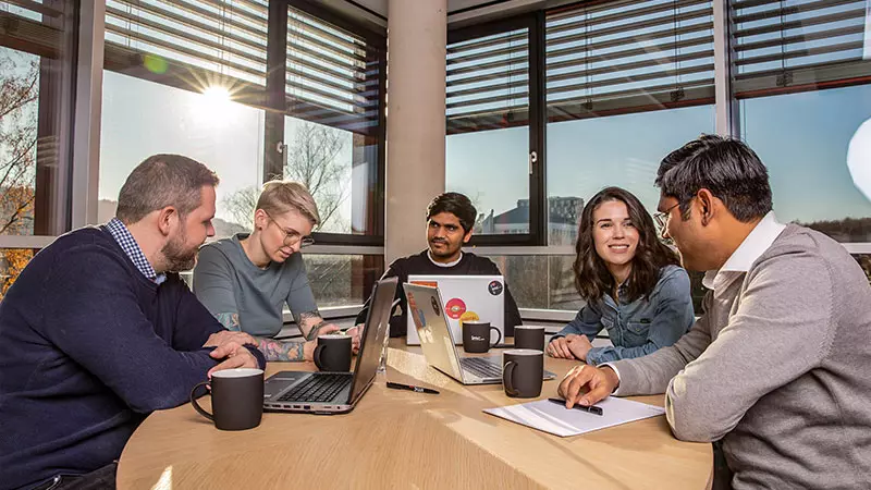 imc employees in meeting room