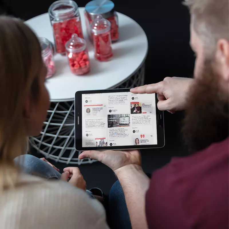 Image of imc colleagues watching on a screen